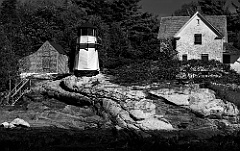 Worn Perkins Island Light on Rocky Shoreline in Maine -BW